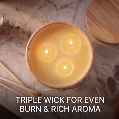 Top view of lit CALMIRAY triple wick candle for even burn and rich aroma
