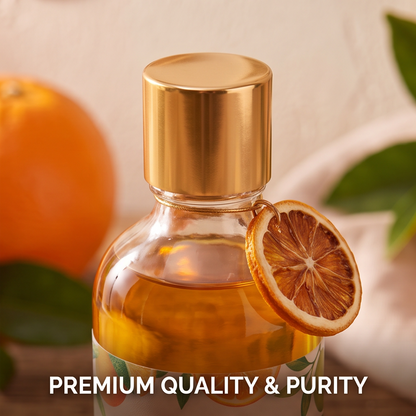 Close-up of golden cap and dried orange slice charm on CALMIRAY citrus oil bottle, premium quality and purity