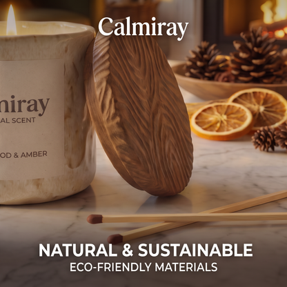 Lit CALMIRAY sandalwood and amber candle in living room by fireplace, create your sanctuary cozy home ambience