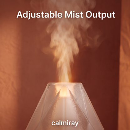 CALMIRAY aroma diffuser on bedside nightstand with candle, aromatherapy and sleep aid