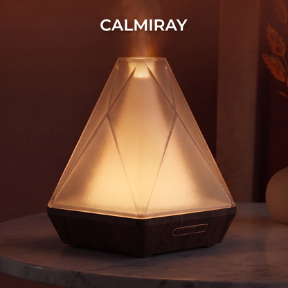 Close-up of CALMIRAY diffuser textured glass and wood-grain base with control buttons, premium glass and wood design